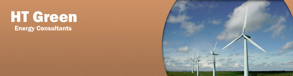 four white wind turbines from right to left standing in a grassy field